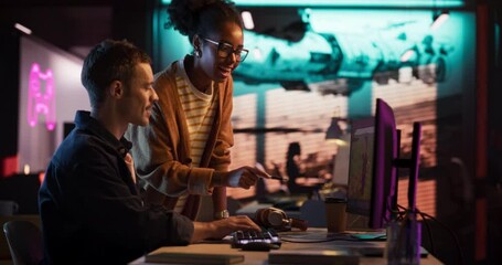 Portrait of Black Creative Director Giving Instructions on 3D Game Visuals to Male Developer in Creative Agency. Two Stylish Diverse Employees Discussing Design on Computer in Game Development Company - Powered by Adobe