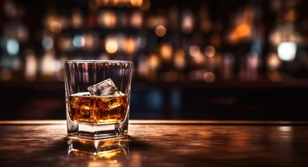 Foto op Plexiglas Glass of whiskey with ice cubes on wooden bar counter © happy_lark