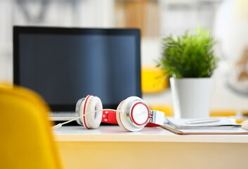 Empty remote office workplace with laptop pc and headset closeup. Receptionist or secretary of...
