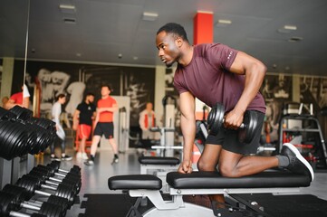 African American young man doing workout at the gym