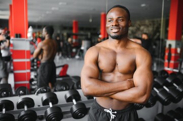 Fototapeta na wymiar Young athletic African American man in the gym
