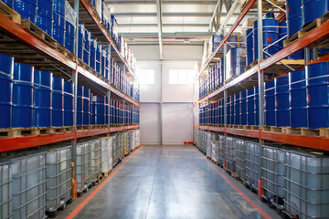 Warehouse petroleum products. Storage interior. Warehouse racks with barrels for liquids. Corridor...