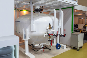 Industrial equipment. Spherical white pressure storage tank. Industrial equipment for factory. Reservoir for fire extinguishing system. Industrial tank with pressure sensors. Abrasive blasting machine