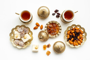 Ramadan party table with tea and sweets. Muslim holiday background