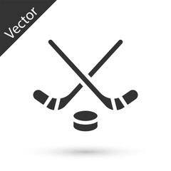 Grey Ice hockey sticks and puck icon isolated on white background. Game start. Vector