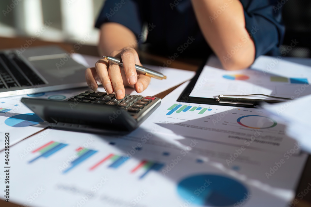 Poster close up of businessperson analysis and calculate chart and graph showing change and growth on the f
