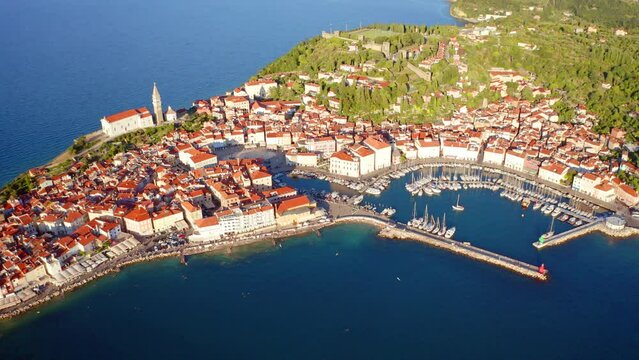 4K aerial - a bird's eye view&nbsp;video (Ultra High Definition) of Piran town. Picturesque outdoor scene of Slovenia&rsquo;s Adriatic coast with beautiful Venetian architecture. Beautiful Mediterranean seascape