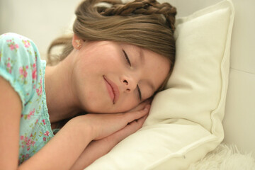 Obraz na płótnie Canvas Cute little girl sleeping in bed at home