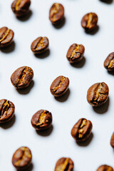 Obraz premium Coffee beans on white background - stock photo