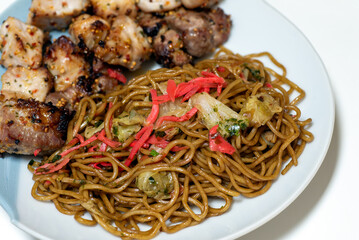 Yakisoba with griled chicken on a plate. Japanese food. 