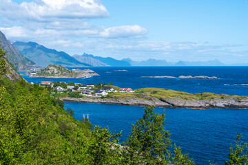 Naklejka na ściany i meble Summer sunny day at Lofoten, Norway, Nordland. Landscape with dramatic mountains and sea, ocean. fjord in the Lofoten Islands