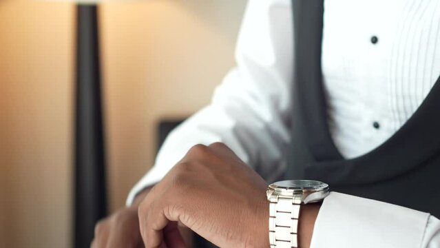 The Groom Putting On The Watch In The Room. Preparations For The Wedding. Elegant Man With Watch