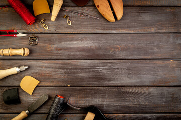 Leather shoe workshop, hand craft. Set of tools on the table