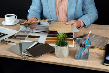 Obraz na płótnie Canvas Male designer choice hard wood flooring samples for renovation at home