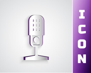 Paper cut Microphone icon isolated on grey background. On air radio mic microphone. Speaker sign. Paper art style. Vector