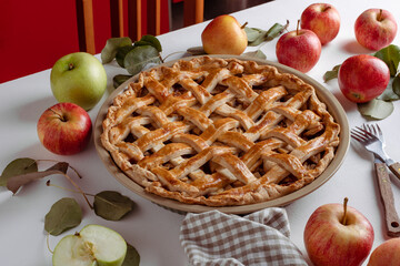 Homemade Apple Pie with fresh apples on a table background, Classic Thanksgiving dessert apple pie