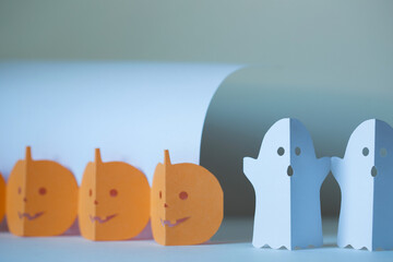 paper craft for kids. DIY paper parts ghost and pumpkin for halloween decoration garlands. create art for children.