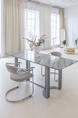 interior of a bright living room in a luxurious baroque style with white walls decorated with antique stucco