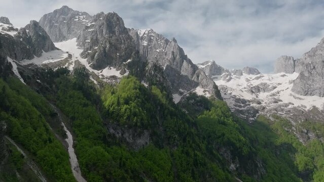 montengro, national park Prokletije - summer stunning mountain valley with a mountainous terrain, aerial wide shot. Cinematic soft light