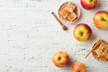 Jewish Holidays - Rosh Hashanah or Rosh Hashana. Pomegranate, apples, honey and round challah on old wooden white table background. Jewish Autumn celebration. Shana Tova. Yom kippur concept. Top view