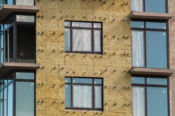 insulation of walls of apartment building under construction