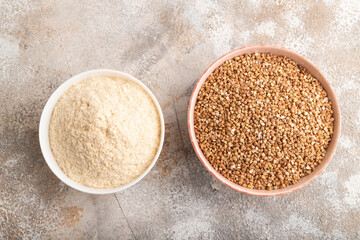 Powdered milk and buckwheat baby food mix, on brown concrete, top view