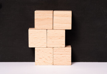 Six empty wooden cubes with place for letters or images