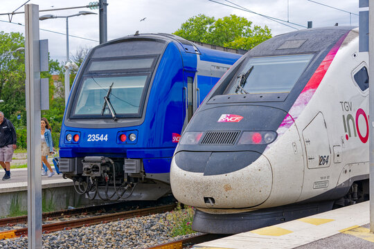 Trains at railway station of City of Hyères on a blue cloudy late spring day. Photo taken June 9th, 2023, Hyères, France.