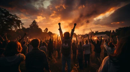 Foto op Plexiglas young people standing with hands raised in the air during sunset in the style of captivating documentary photo © RWC