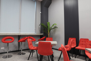 office dining room with red chairs and artificial wood