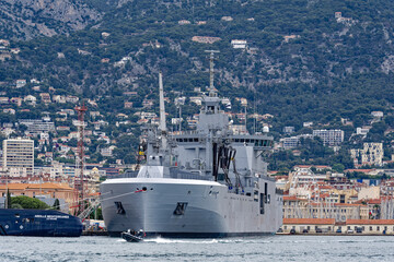 Moored supply warship and tanker of French Navy at Toulon Naval Base on a cloudy spring day. Photo taken June 9th, 2023, Toulon, France. © Michael Derrer Fuchs