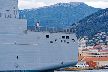Moored supply warship and tanker of French Navy at Toulon Naval Base on a cloudy spring day. Photo taken June 9th, 2023, Toulon, France. © Michael Derrer Fuchs