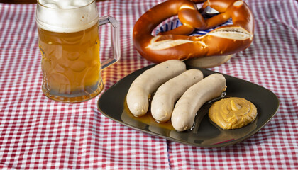 Bavarian meal with white sausage, sauerkraut, pretzel and a Maß of beer