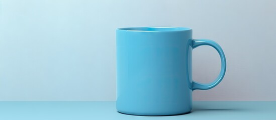 Blue plastic mug with lid valve on a isolated pastel background Copy space