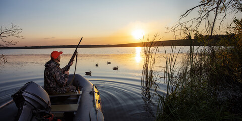 Waterfowl Hunter In Boat. Hunting season. Horizontal banner.