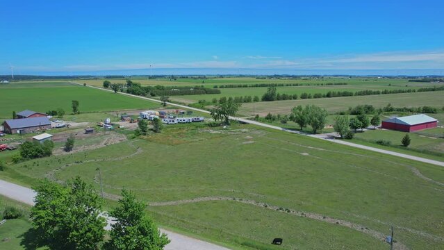 Shot of Canada south countryside at summer season, view from above. Farms and fields of wheat and crops. Rural Canadian county side landscape.