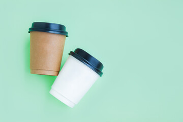 White and Brown paper coffee cup on green background, Takeaway coffee cup