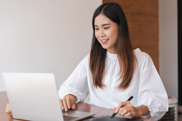 Businesswomen use digital tablet with stylus pen and analysis finance data of new startup on laptop