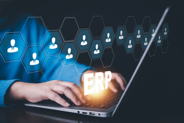 Business people using a laptop with document management for ERP. Enterprise resource planning concept,Enterprise Resource Management ERP software system for business resources plan presented.