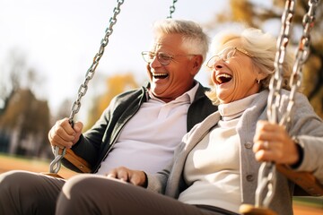 Obraz premium woman man senior couple happy retirement together elderly active vitality park fun smiling love old nature wife happiness mature walking holding hands swing