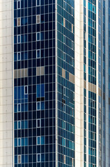many windows and walls facade of a modern skyscraper without people