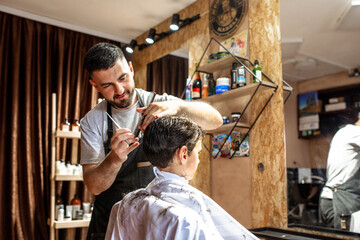 Little boy at the barber shop