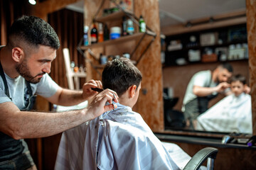 Little boy getting his new haircut