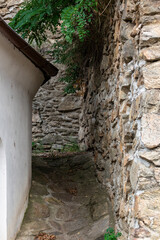 Naklejka premium A remote path by the medieval walls