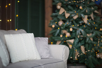 Christmas decor, home textiles. background with christmas three and sofa