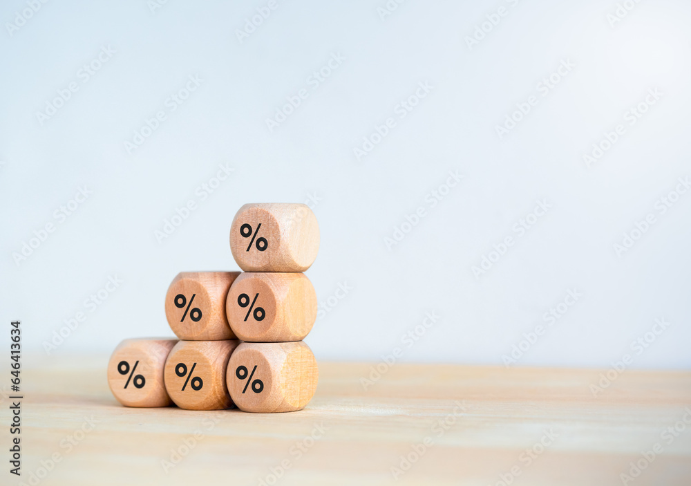 Poster percentage icon on wooden cube blocks as bar graph chart steps isolated on wood table and white back
