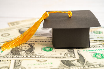 Graduation gap hat on Euro and US dollar banknotes money, Education study fee learning teach...