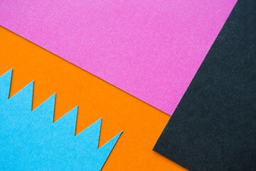 colored cardboard of different shapes. bright abstraction made of paper