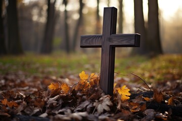 cross on a cemetery outside in the forest halloween