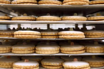 side on view of trays of freshly made jam tarts
